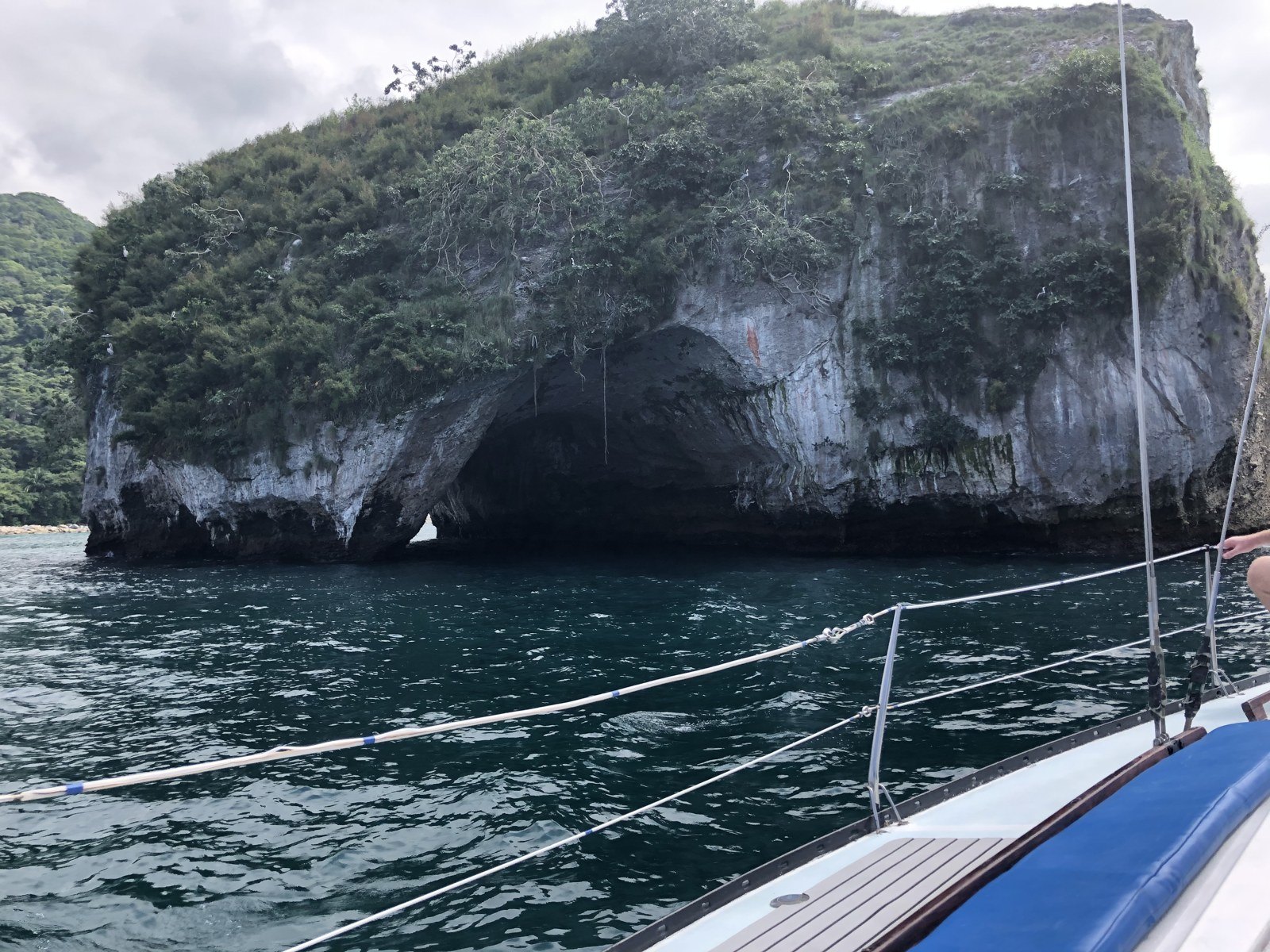 A rock formation rising from the water along the Banderas Bay coast