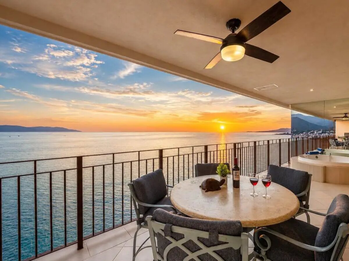 Grand Venetian penthouse terrace at sunset