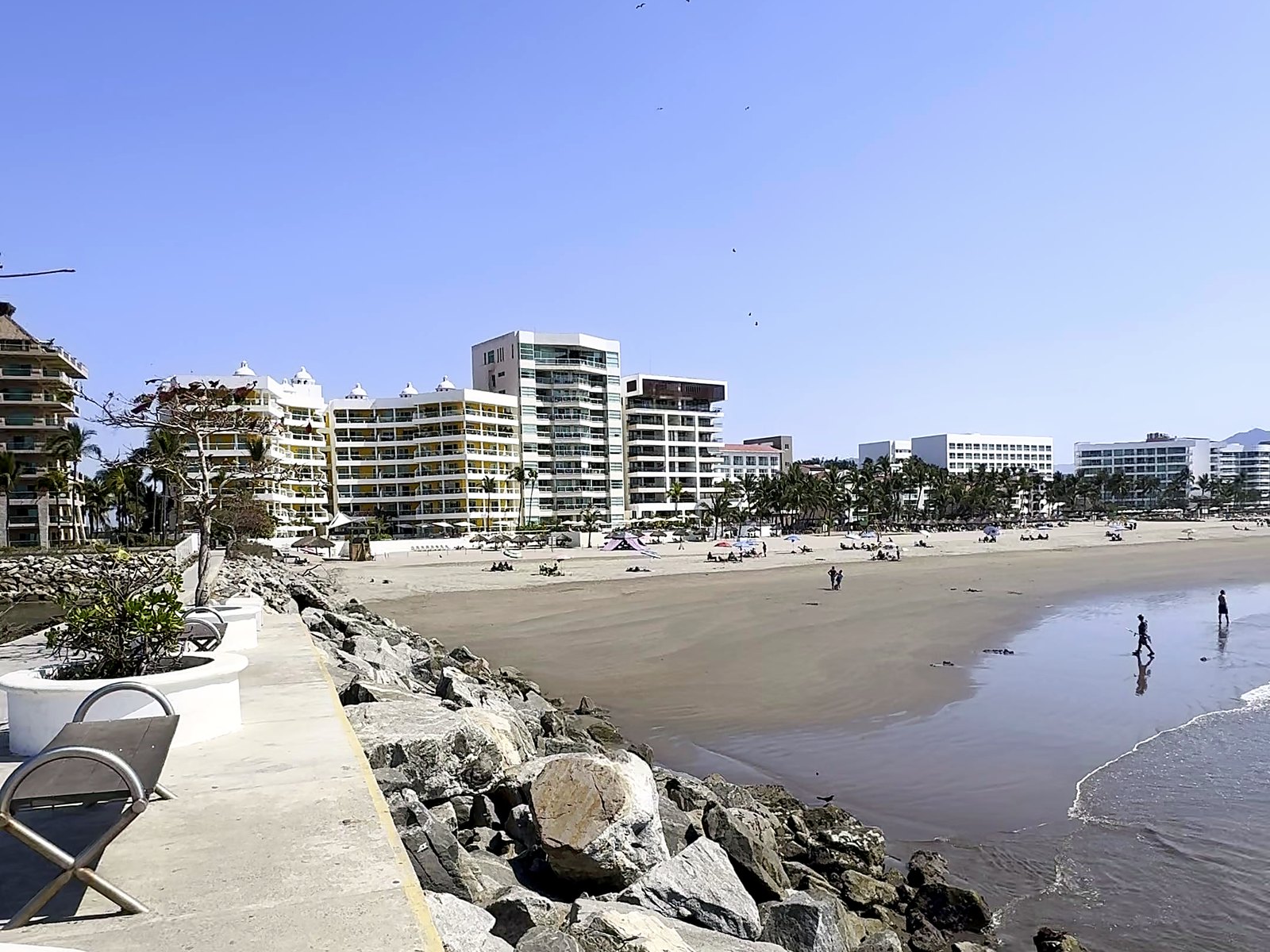 The seawall walkway at Nuevo Nayarit with the beach and resort towers beyond