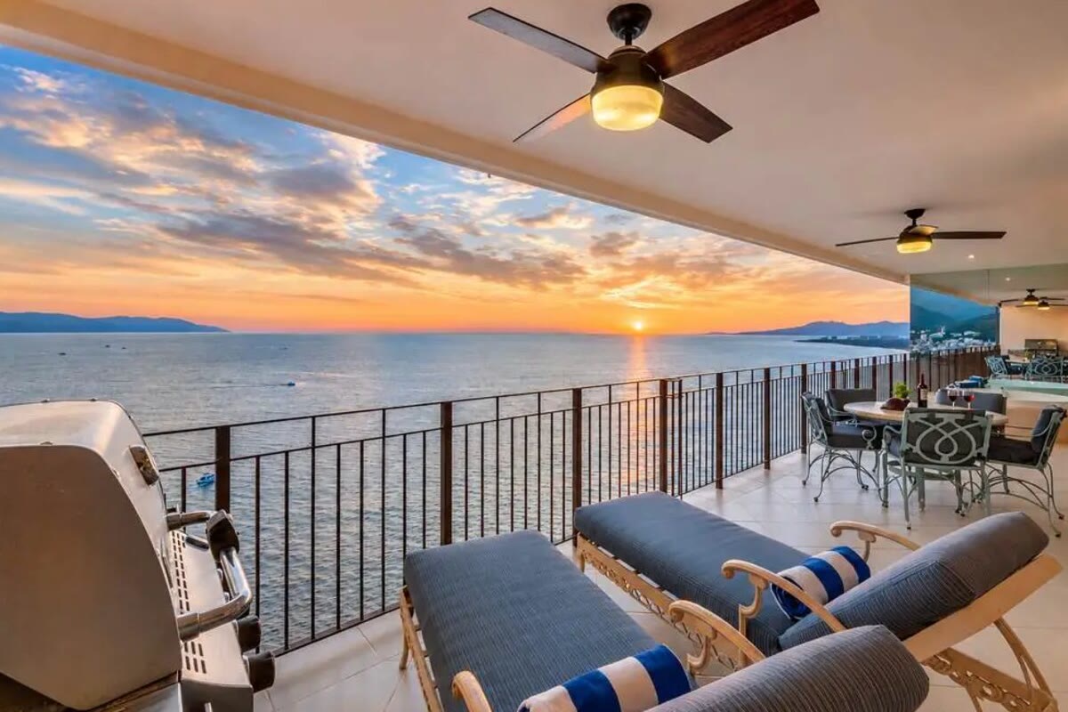 A covered oceanfront terrace at sunset in Puerto Vallarta
