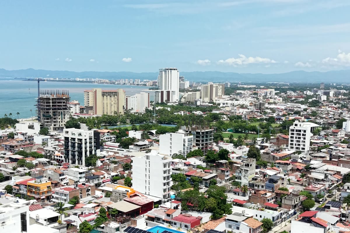 Puerto Vallarta from the air in 2026, towers and cranes along the shoreline